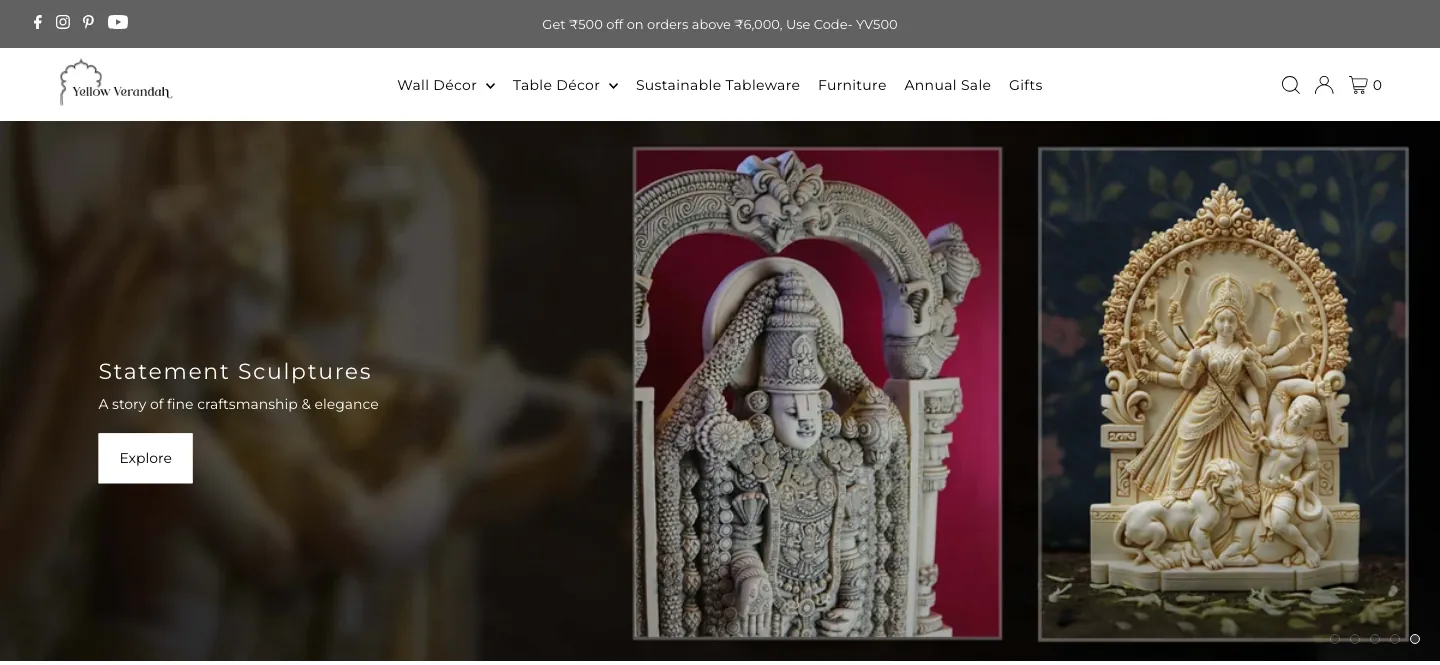 Yellow Verandah homepage with category menu and a Statement Sculptures banner showing two carved sculptures