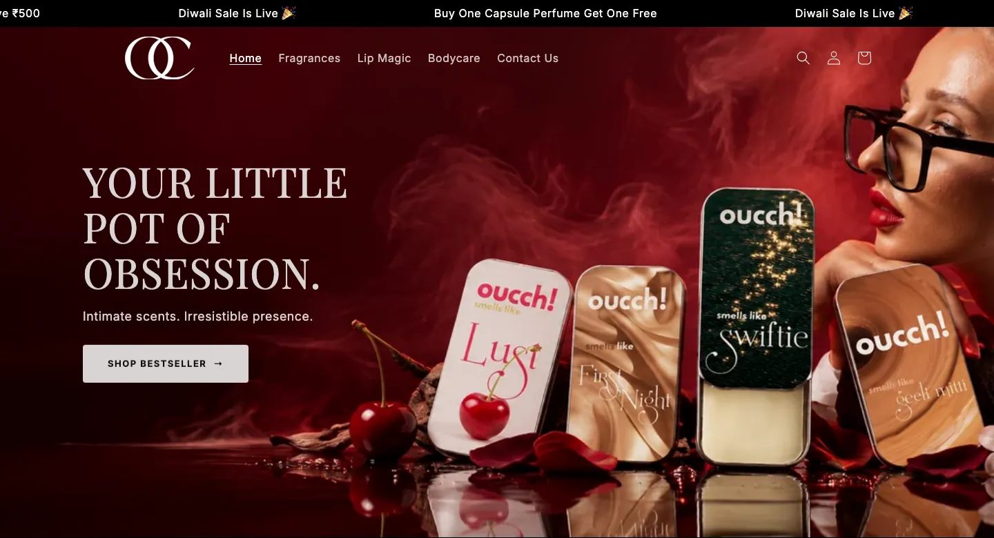 Oucch homepage with a minimal menu and a dark red hero showing solid perfume tins and a Shop Bestseller button Oucch homepage with a minimal menu and a dark red hero showing solid perfume tins and a Shop Bestseller button